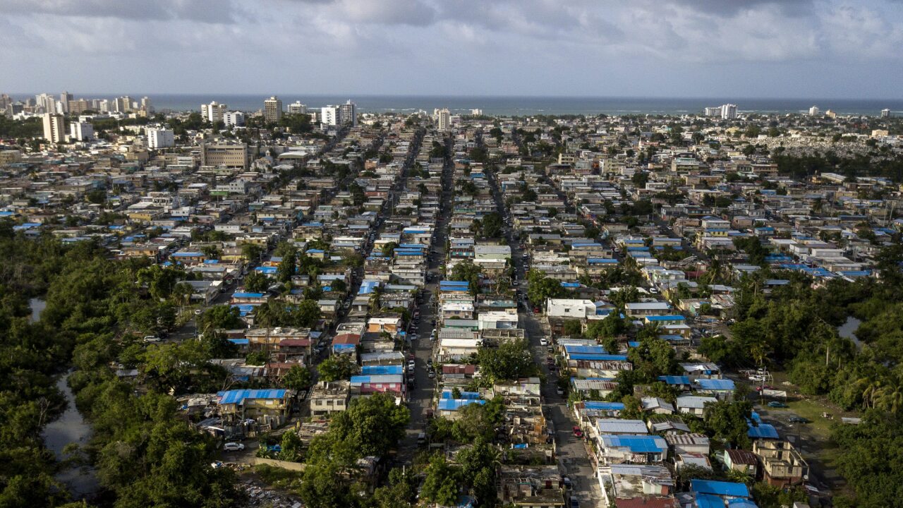 Blue roof temporary tarps are seen in an aerial photograph taken over San Juan, Puerto Rico.