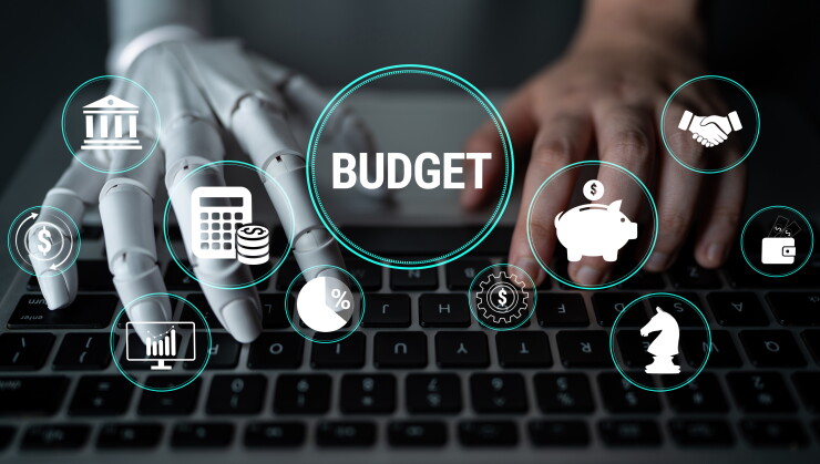 Conceptual Image of Budgeting with Robotic Hand and Human Interaction in Financial Planning Using Technology for Future Finance Management. Glyphic.