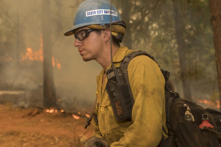 A Silver City Hotshot firefighter tackling the Taylor Creek and Klondike Fires in the Rogue-Siskiyou National Forest in Oregon on Aug. 11, 2018.