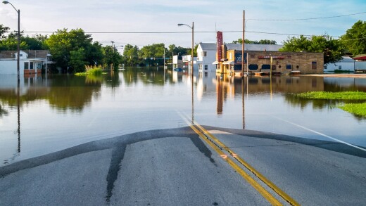Panoramic view of a flooded town street.