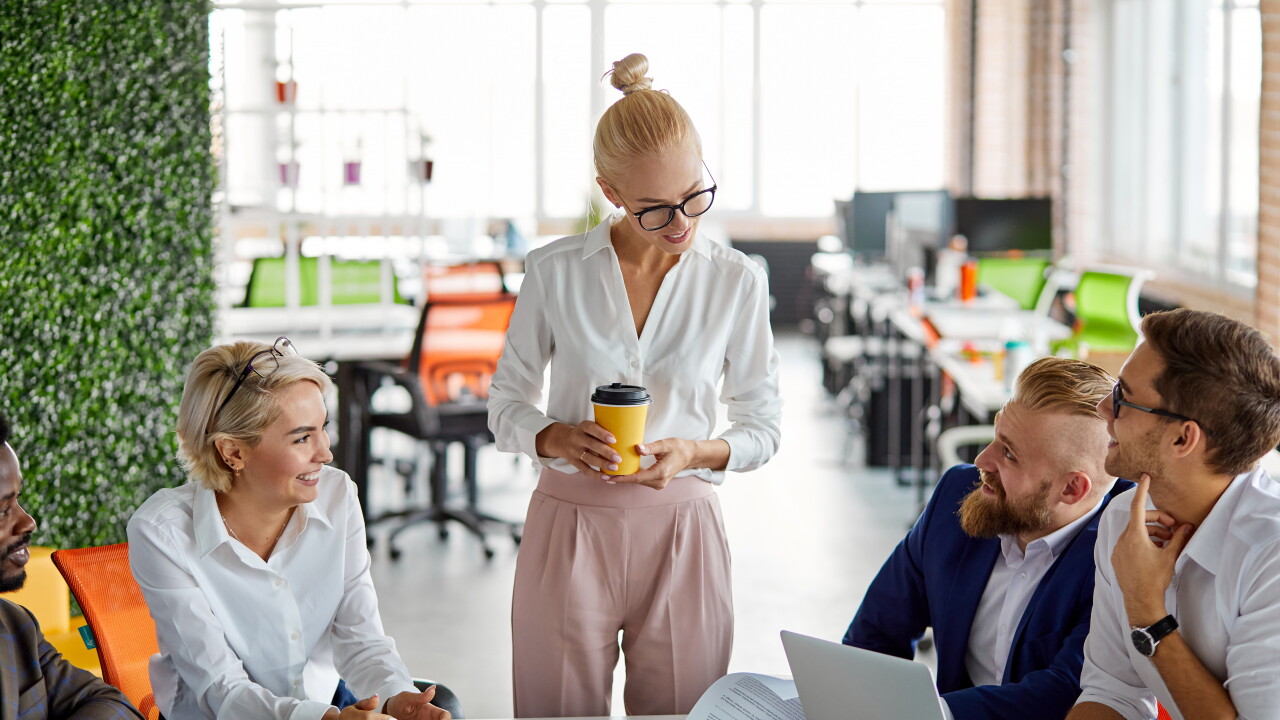 Employees talking, nice office, drinking coffee, collaborating