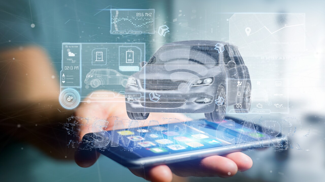 Man holding a Dashboard smartcar interface from smartphone