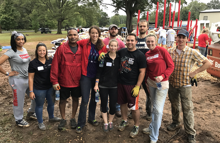 CSI employees helping build playgrounds in Charlotte.