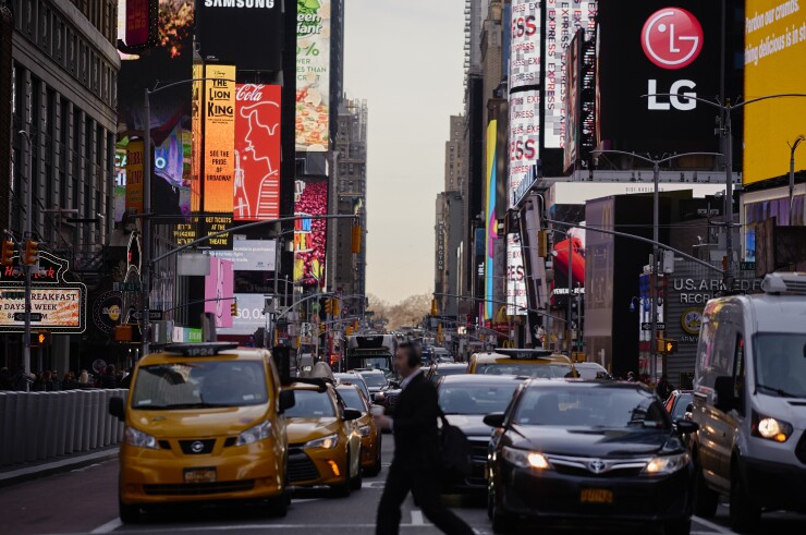 Vehicles sit in traffic during rush hour in the Times Square area of New York, U.S., on Tuesday, April 2, 2019.