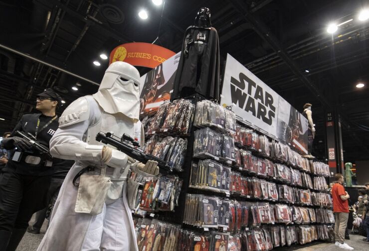 Fans dressed as characters walk through the exhibition floor during the Star Wars Celebration event at McCormick Place convention center in Chicago, Illinois, U.S., on Friday, April 12, 2019.