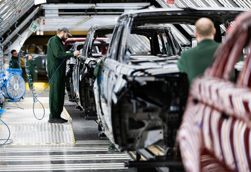 An employee polishes paint on the bodywork of a Range Rover sports utility vehicle (SUV) in the paint shop at Tata Motors Ltd.'s Jaguar Land Rover vehicle manufacturing plant in Solihull, UK, on Friday, Jan. 20, 2023. Tata Motors are due to report their latest results on Wednesday. Photographer: Chris Ratcliffe/Bloomberg