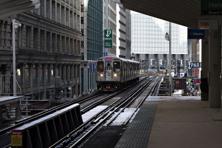 A Chicago CTA L Train arrives at a station in on Wednesday, Jan. 30, 2019.