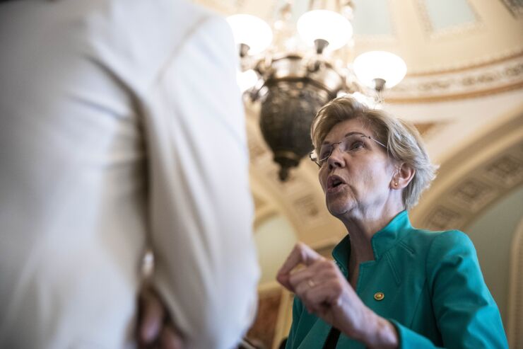 “The Fed’s record over the past four years — I see one move after another to weaken regulation over Wall Street banks,” said Sen. Elizabeth Warren. “And that worries me.”