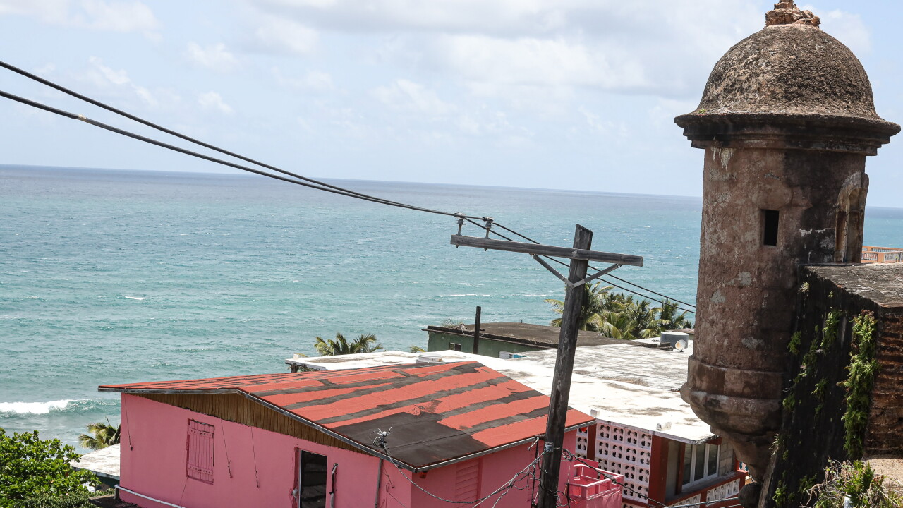 Old and new buildings and the Caribbean in San Juan 2022.
