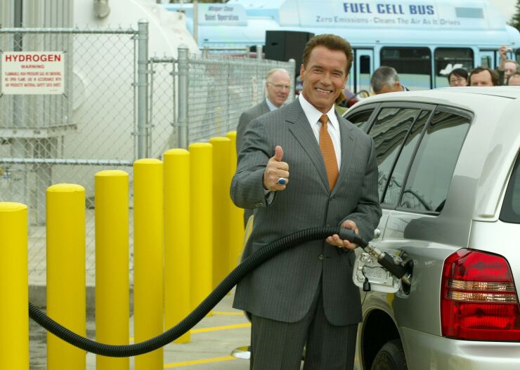 California Gov. Arnold Schwarzenegger pumps hydrogen into a fuel-cell vehicle in 2004.