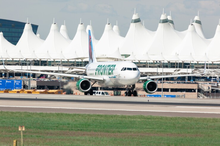 A Frontier Airlines plane taxis in front of the Jeppesen Terminal at Denver International Airport in 2016.