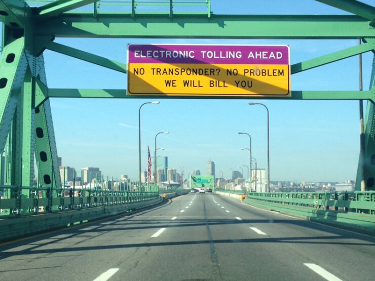 Signs inform drivers of electronic toll collection on the Tobin Bridge in Boston