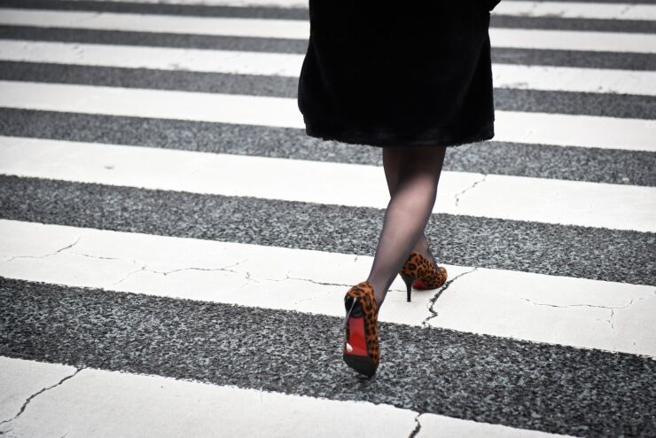 A pedestrian crosses a street in Tokyo on Feb. 8, 2019.