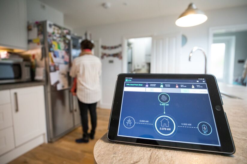 An Apple Inc. iPad, displaying flows of electricity within a Lightsource BP smart home, sits on a work surface in the kitchen of a residential property in Dorking, U.K., on Friday, May 3, 2019. Companies like Lightsource, in which British oil major BP Plc holds a stake, are trialing smart systems in people’s homes that will that will do everything from generating solar power, storing it and managing consumption. Photographer: Chris Ratcliffe/Bloomberg