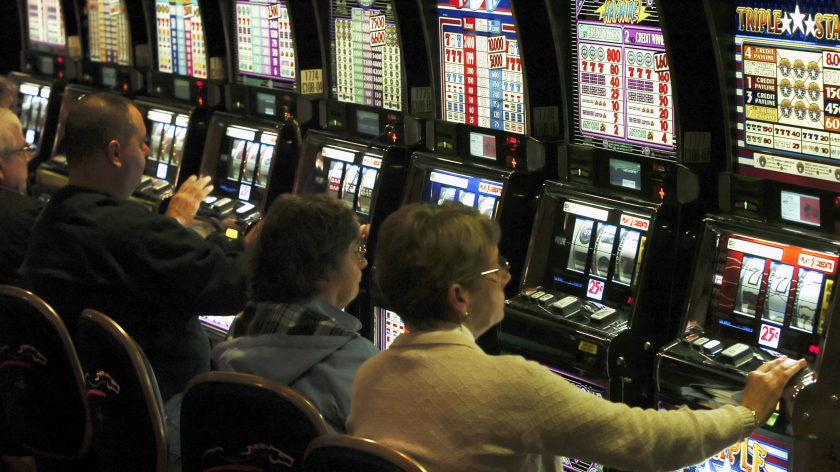 Patrons play slot machines at the Mohegan Sun at Pocono Downs in Wilkes-Barre, Pa.