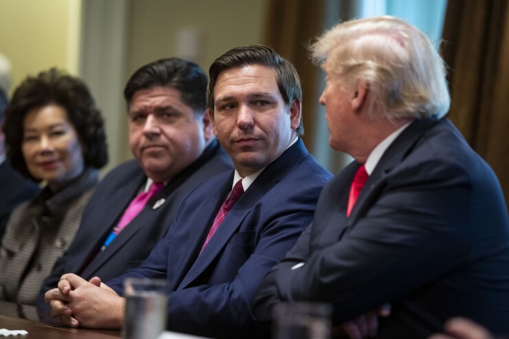 Ron DeSantis, governor-elect of Florida, listens as U.S. President Donald Trump speaks during a meeting in the Cabinet Room of the White House in Washington, D.C., U.S., on Thursday, Dec. 13, 2018.