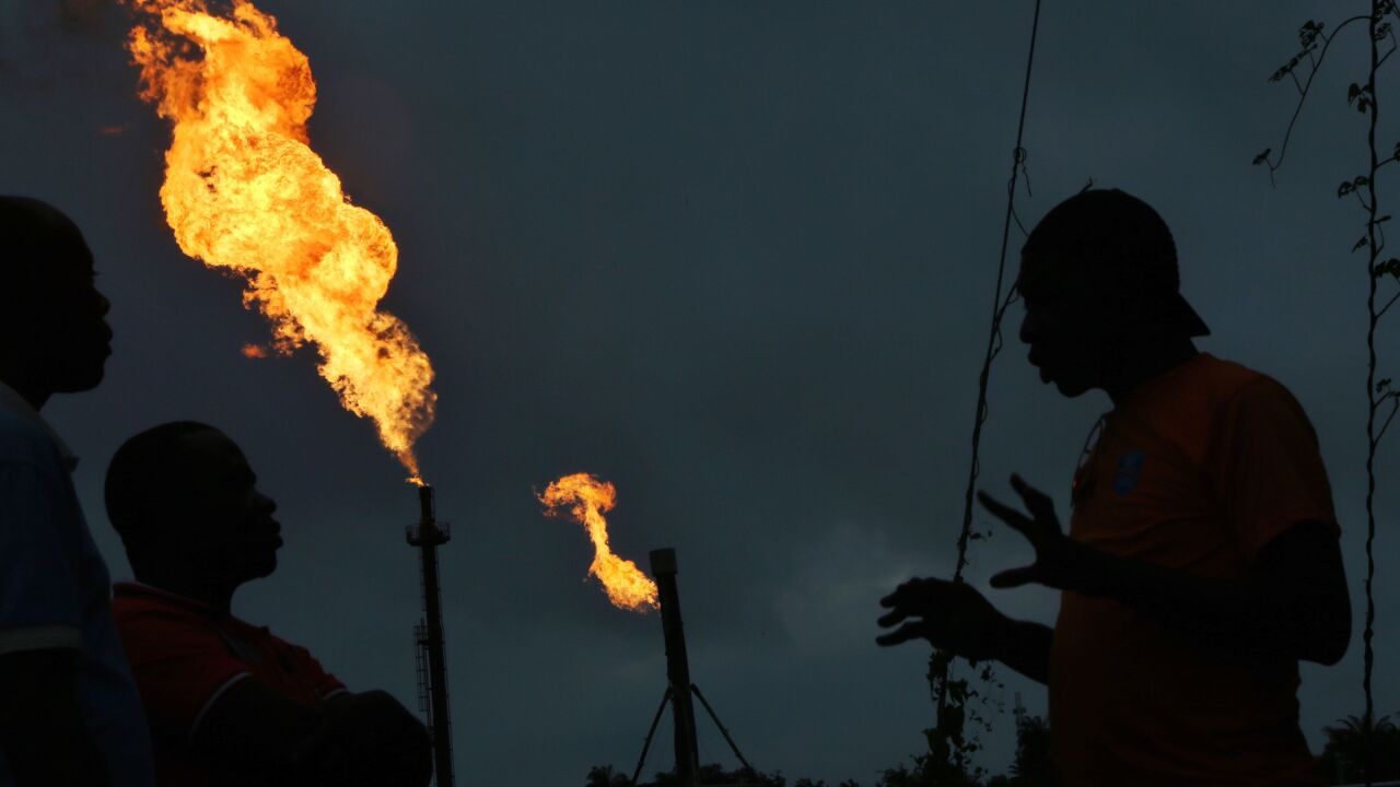 Gas flares burn from pipes at an oil flow station operated by Nigerian Agip Oil Co. Ltd. (NAOC), a division of Eni SpA, in Idu, Rivers State, Nigeria, on Monday, Sept. 28, 2015. Nigeria's daily output of about 2 million barrels of oil makes it Africa's largest producer. Photographer: George Osodi/Bloomberg