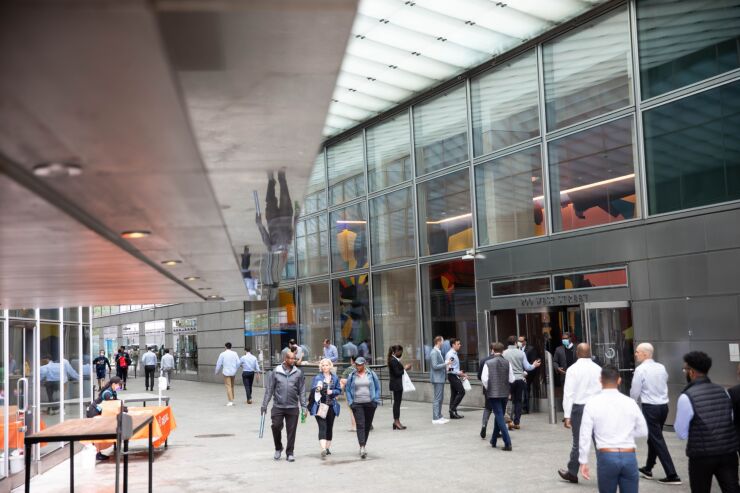 People walk past the Goldman Sachs headquarters building in New York, U.S., on Monday, June 14, 2021. Goldman Sachs Group Inc. is bringing thousands of employees back to the office across the U.S. Monday for the first time in more than a year. Photographer: Michael Nagle/Bloomberg