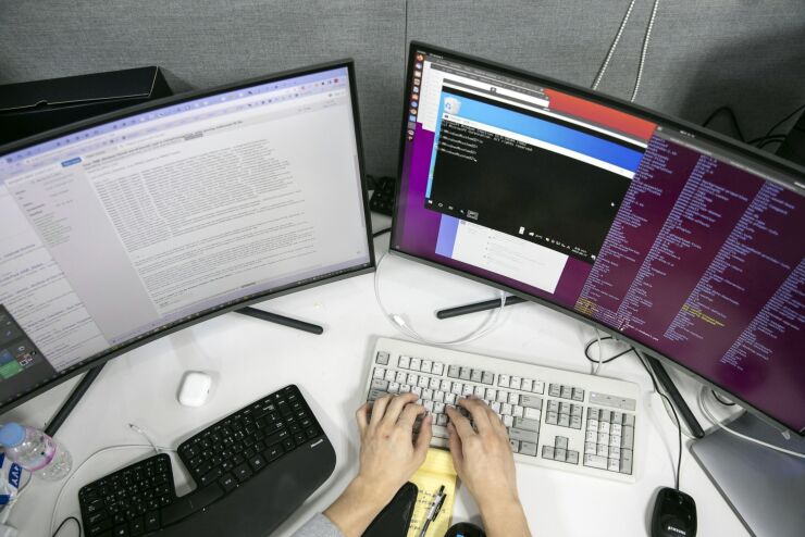 An employee at his desk at S2W Inc., a South Korean cybersecurity company, in Pangyo Techno Valley, Seoul, South Korea, on Wednesday, Aug. 17, 2022. The majority of S2W workers have expertise in North Korea, and they work with international law enforcement to thwart North Korean hacking attempts. The company also has private-sector clients in e-commerce, automotive, semiconductors, and biotech. Photographer: Woohae Cho/Bloomberg