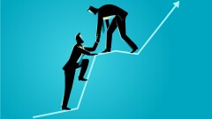 businessmen-helping-each-other-123825396-adobe