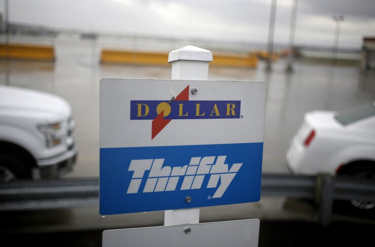 Dollar Thrifty car rental signs