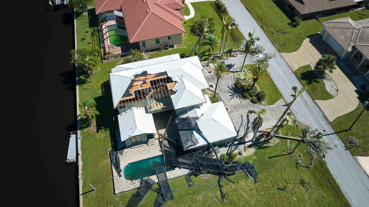 Hurricane Ian destroyed house in Florida residential area.