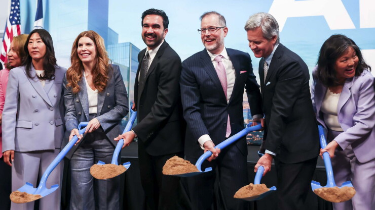 A group of people holding shovels of dirt, with New York Mayor Zohran Mamdani and Comptroller Mark Levine at center
