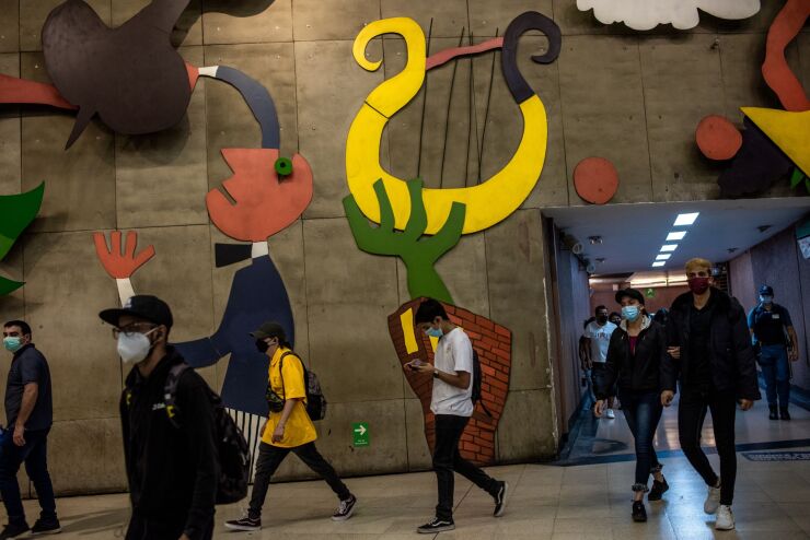 Commuters in a subway station in Santiago, Chile, on Monday, March 28, 2022. Chile's central bank is likely to increase its benchmark rate by 150 basis points to 7.0% on March 29. Photographer: Cristobal Olivares/Bloomberg