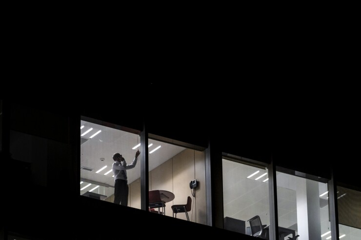 office-man-window-bloomberg