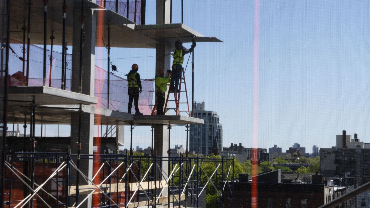 Contractors work at a commercial development under construction in the Brooklyn borough of New York, US, on Monday, May 9, 2022. US construction activity is now exceeding prior levels -- including the 2005 peak -- with the bulk of leading indicators sending bullish signals for the next 12 months. Photographer: Eilon Paz/Bloomberg
