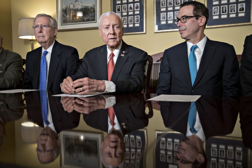 Hatch, Orrin Hatch flanked by Mitch McConnell and Steve Mnuchin