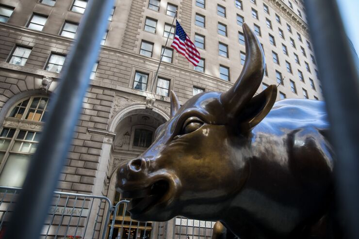 Charging Bull statue stands near the New York Stock Exchange on June 17, 2020