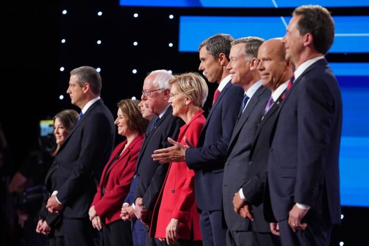 Democratic presidential candidates Marianne Williamson, (L-R), Rep. Tim Ryan (D-Ohio), Sen. Amy Klobuchar (D-Minn.), Indiana Mayor Pete Buttigieg, Sen. Bernie Sanders (I-Vt.), Sen. Elizabeth Warren (D-Mass.), former Texas congressman Beto O'Rourke, former Colorado governor John Hickenlooper, former Maryland congressman John Delaney, and Montana Gov. Steve Bullock.