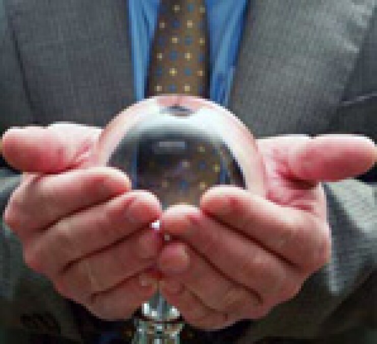 Person holding a crystal ball in their hands.