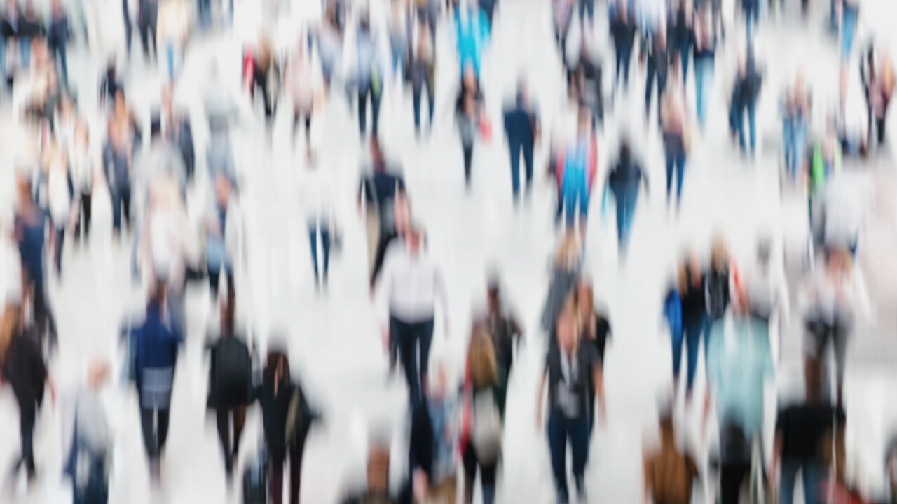 Crowd of anonymous, blurred people.