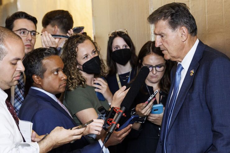 manchin-joe-senate-reporters.jpg