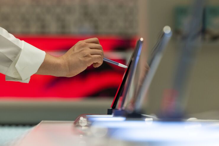 An employee inspects a Samsung Electronics Co. Galaxy S21 Ultra 5G smartphone at the company's Digital Plaza store in Seoul, South Korea, on Saturday, July 3, 2021. Samsung Electronics will releases its preliminary second quarter earnings on July 7. Photographer: SeongJoon Cho/Bloomberg