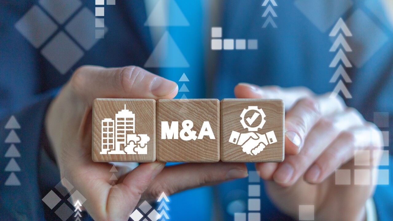Merger and Acquisition Business Corporate Cooperation Company concept. M&Q partnership concept on wooden dices in businessman's hands.