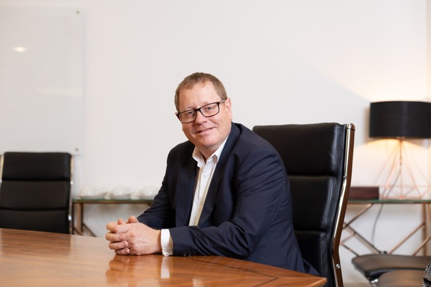 Headshot of Simon Ball, CEO of Quotall.