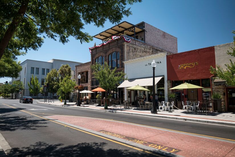 Restaurants stand on Main Street in Napa, California, U.S., on Wednesday, July 29, 2020. From California's wine country to Colorado's ski towns and Florida’s beaches, American cities that built their economies around tourists are being upended by Covid-19. Photographer: David Paul Morris/Bloomberg