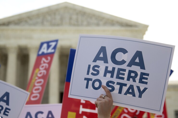 Demonstrators outside the Supreme Court in advance of the court's rulling that the ACA was constitutional