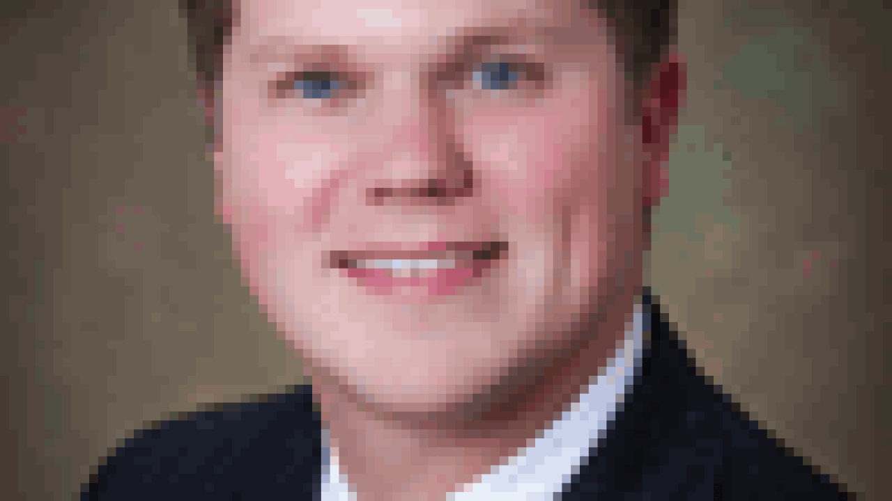 colquetttravis100x133.gif