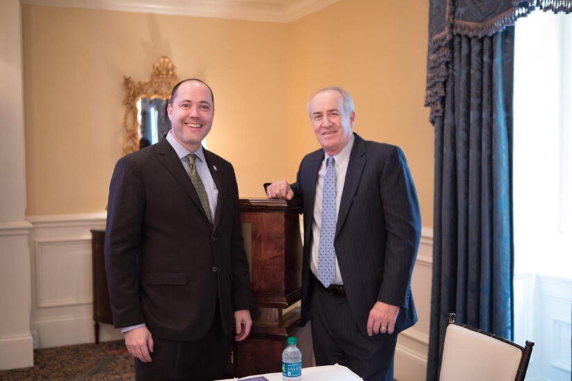 Attorney General Chris Carr stands with President/CEO of Georgia Credit Union Affiliates Mike Mercer at the GCUA Legislative Reception.