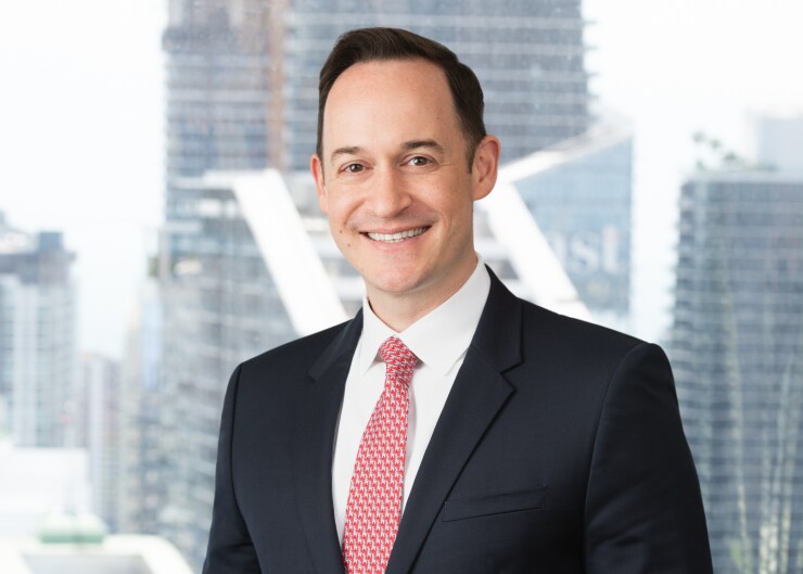 Andrew Hinkes, attorney at Carlton Fields and founder of Athena Blockchain, Inc.