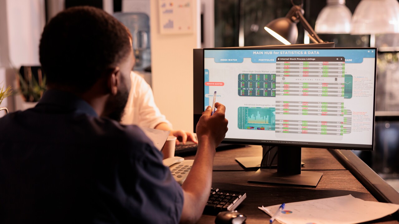 Man working at computer analyzing data