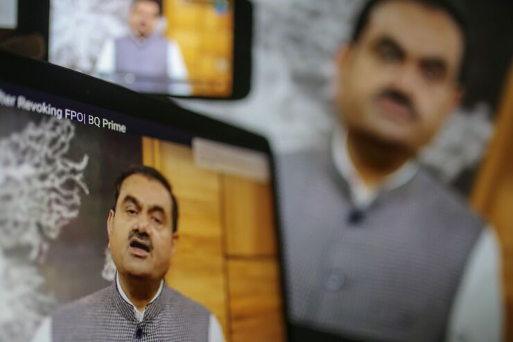 Gautam Adani, billionaire and chairman of Adani Group, during a video speech on monitors in Mumbai, India, on Thursday, Feb. 2, 2023.