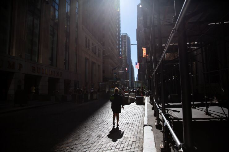 Traders On Floor Of NYSE As U.S. Markets Reopen After Holiday