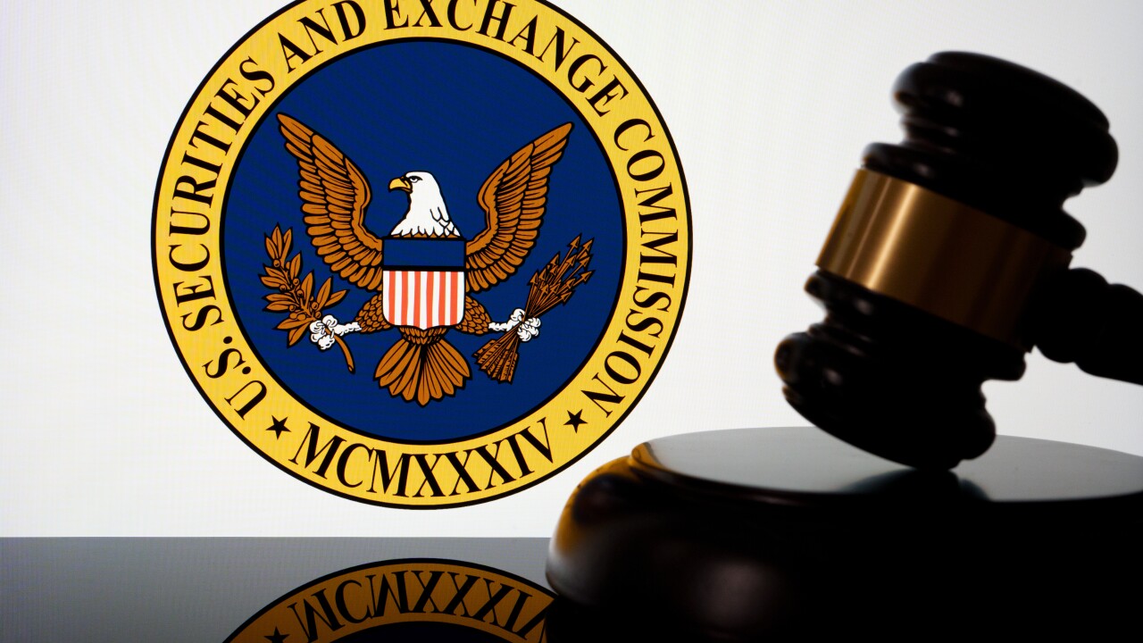 US Securities and Exchange Commission SEC logo seen on the screen and judges gavel next to it. Concept for lawsuit and litigation. Stafford, United Kingdom, April 28, 2024