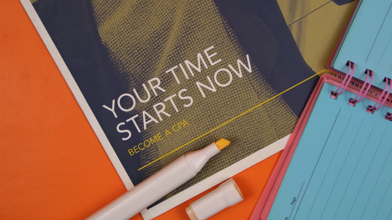 Document that says on its cover, "Your Time Starts Now. Become a CPA" near highlighter pen and notebook