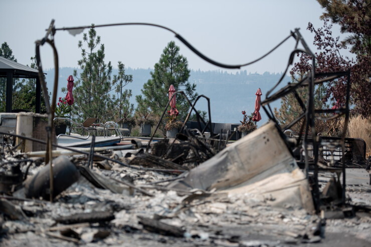 The backyard of a home destroyed in the Old Trails Fire in Spokane, Washington